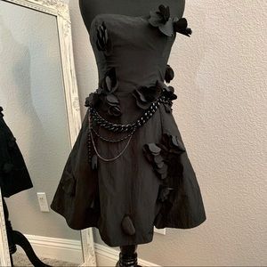 Unique Black Bebe Floral Party Dress with a chain